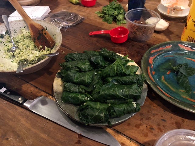 A plate of chaya leaves stuffed like the Greek dolmades